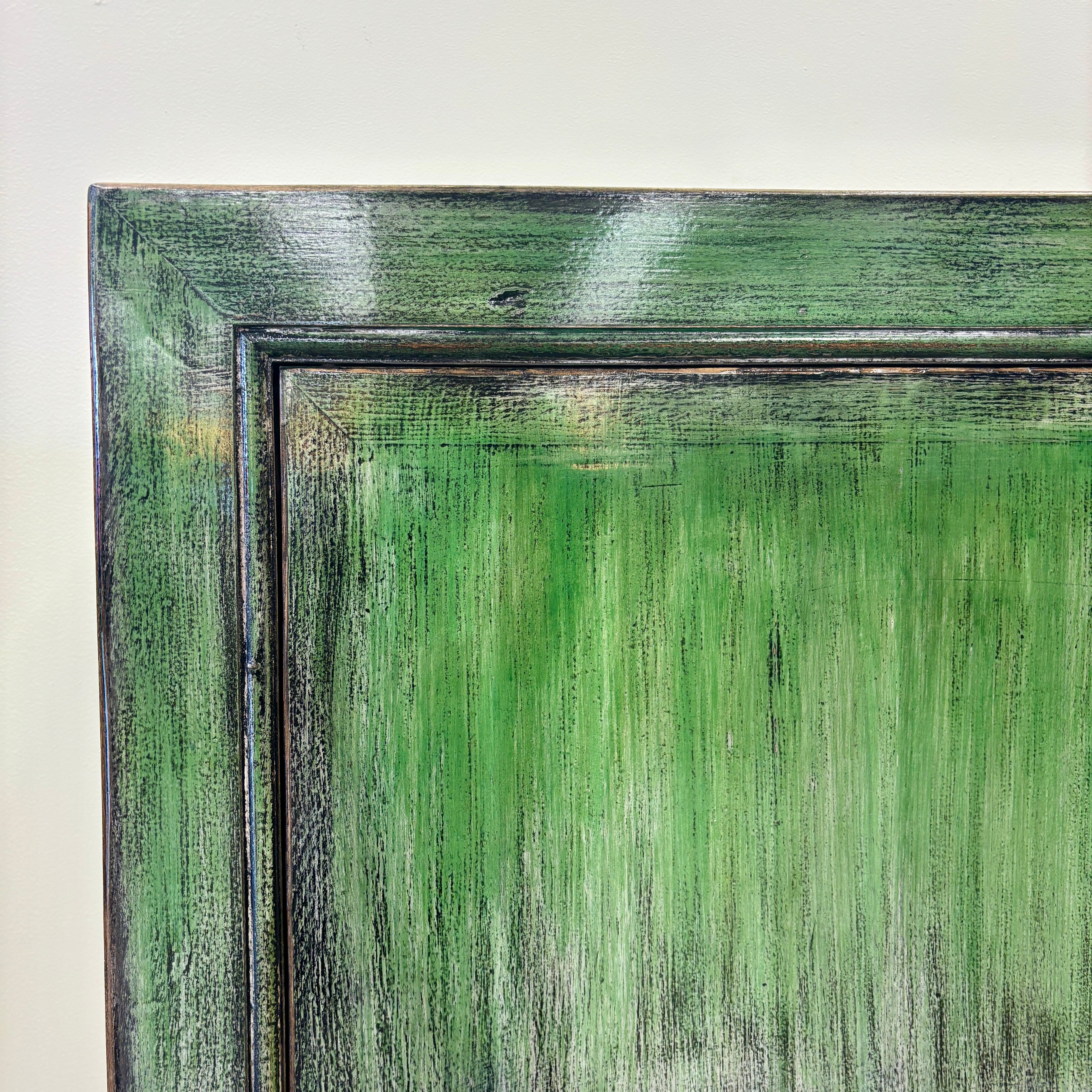 Close-up of the Rosa Sideboard showing its layered distressed emerald green finish