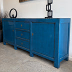 Left angled view of Rosa royal blue sideboard showing cupboard and drawer storage