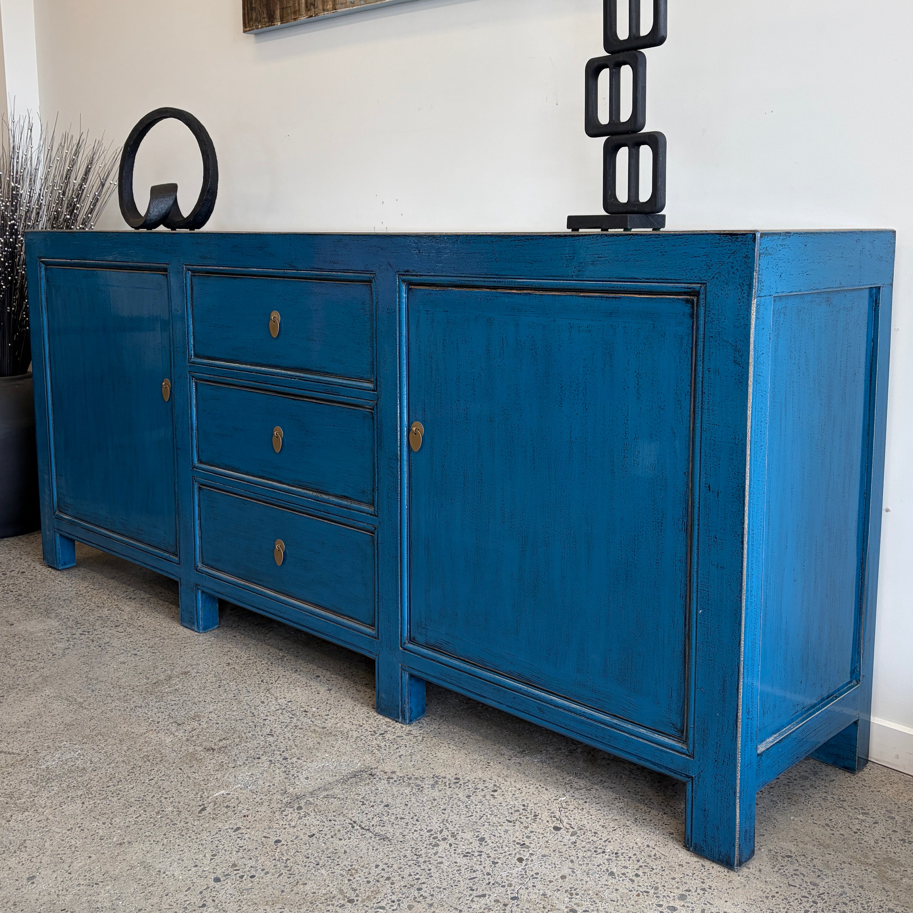 Left angled view of Rosa royal blue sideboard showing cupboard and drawer storage