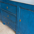Right angled view of Rosa royal blue sideboard with drawers and cupboard storage