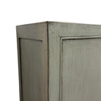 Close up of Rosa Sideboard showing textured sage grey finish and panelled detailing