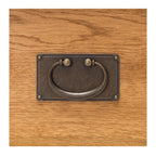 Close up of Salisbury Buffet 2 Door showing antique-style metal drawer pull and natural oak grain