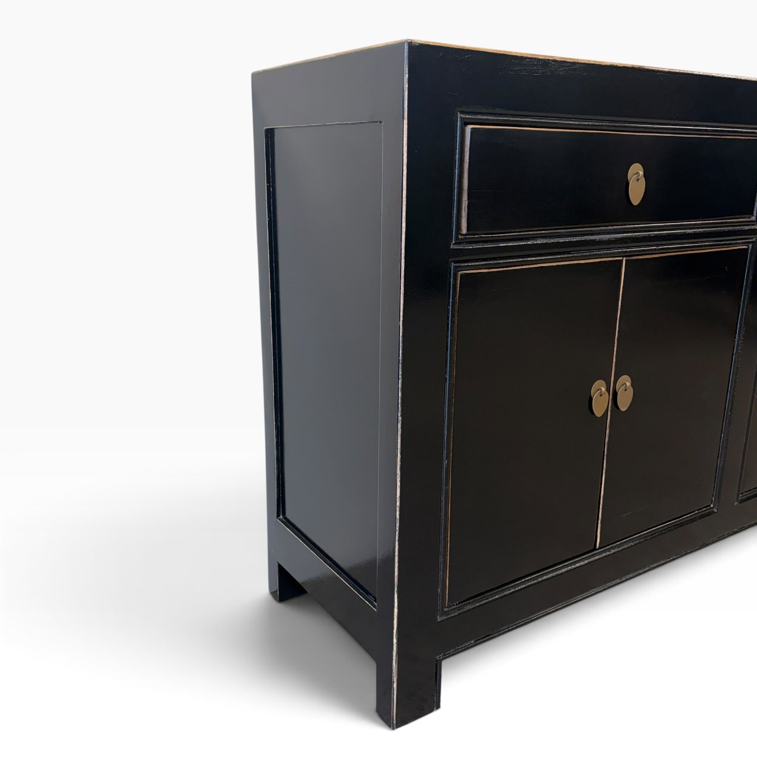 Angled view of Sara black sideboard with gold-toned detailing