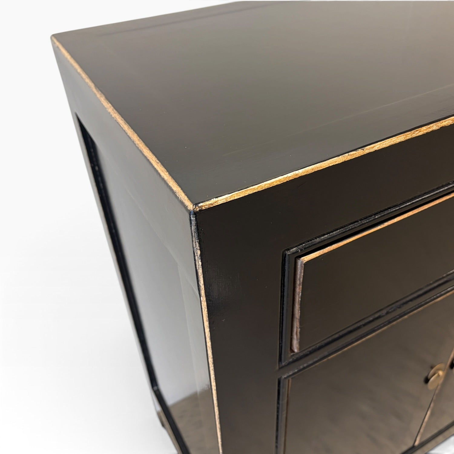 Close-up of Sara Sideboard black finish and gold-toned edging