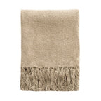 A folded beige knit throw blanket with fringed edges, shown against a plain white background.