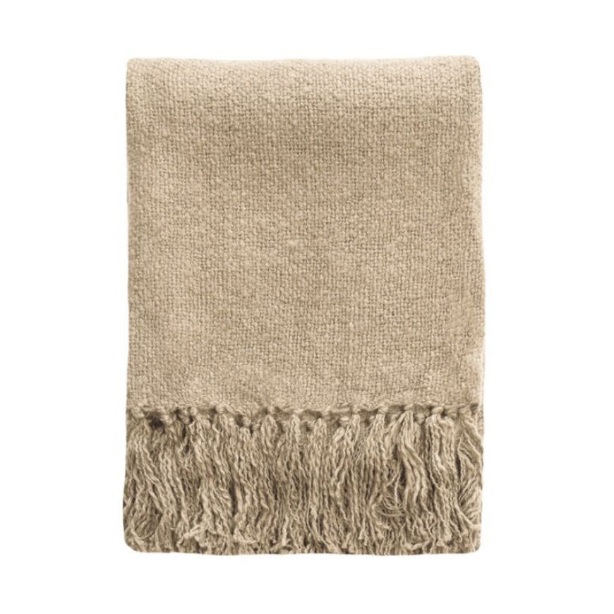 A folded beige knit throw blanket with fringed edges, shown against a plain white background.