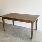 Angled view of the Sienna Dining Table showing its solid mango wood construction and Smokehouse finish.