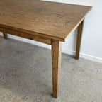 End view of the Sienna Dining Table featuring its clean, timeless design and solid timber construction.