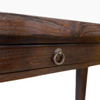 Close-up of console desk drawer with metal ring handle and textured teak timber