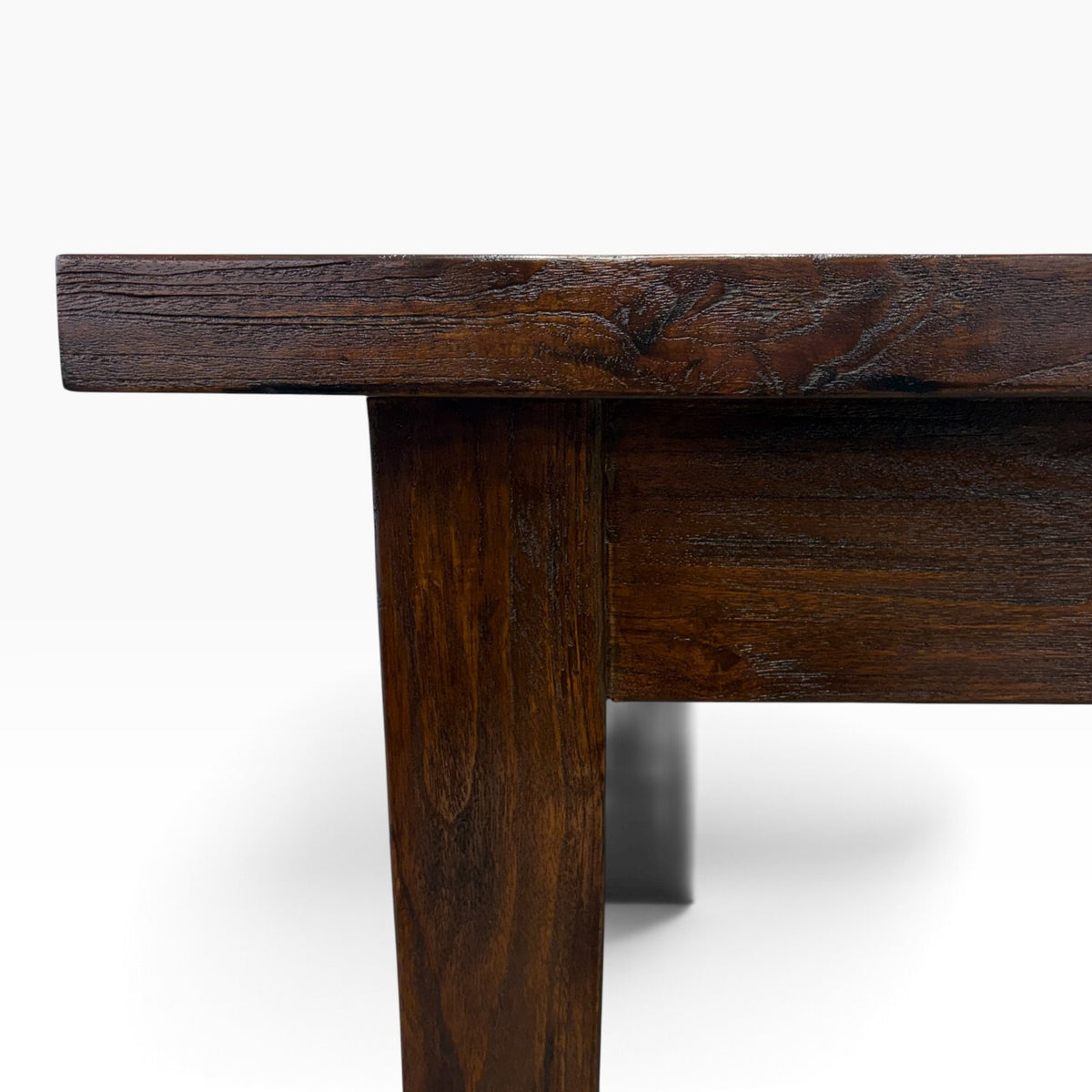 Close-up of solid teak console desk showing rich timber grain and rustic finish
