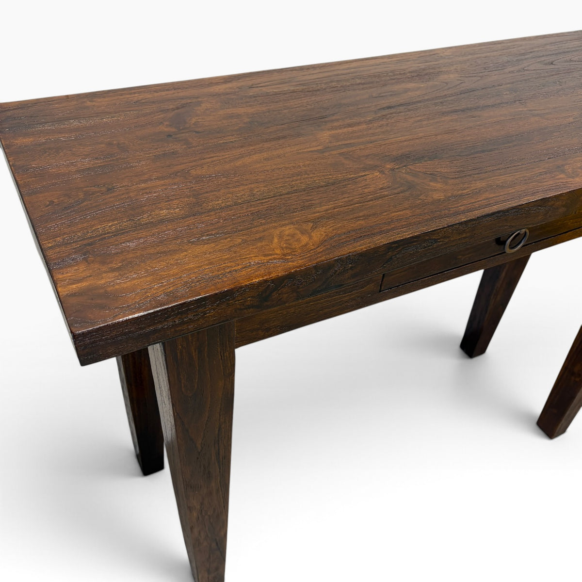Angled view of solid teak console desk showing natural timber grain and spacious tabletop