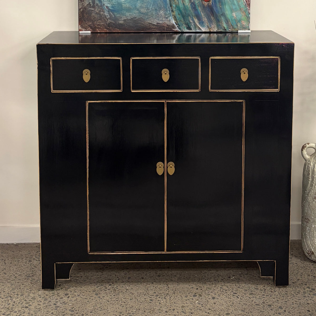 Sunny Sideboard in Black with three drawers, two doors and brass hardware