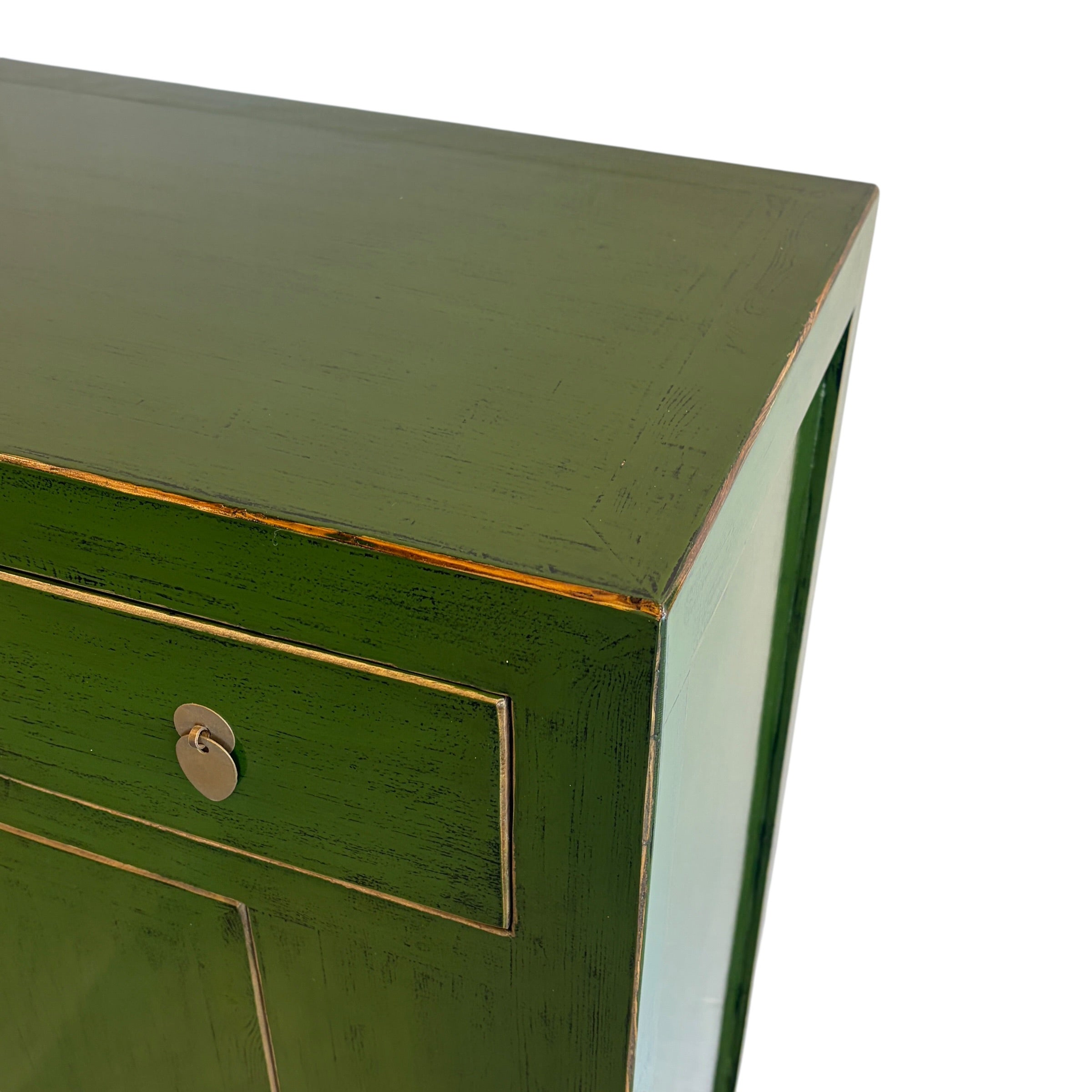Close up of Sunny Sideboard showing emerald green finish, subtle aged edging and brass toned handle