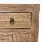 Close-up of the Sunny Sideboard drawer showing natural elm grain and antique brass-style ring handle