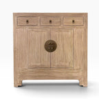 Front view of the Sunny Sideboard in Natural Elm with three drawers, two doors and antique brass-style hardware