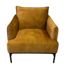 Angled view of the Sydney armchair in Gold, showcasing its curved silhouette and upholstered seat.