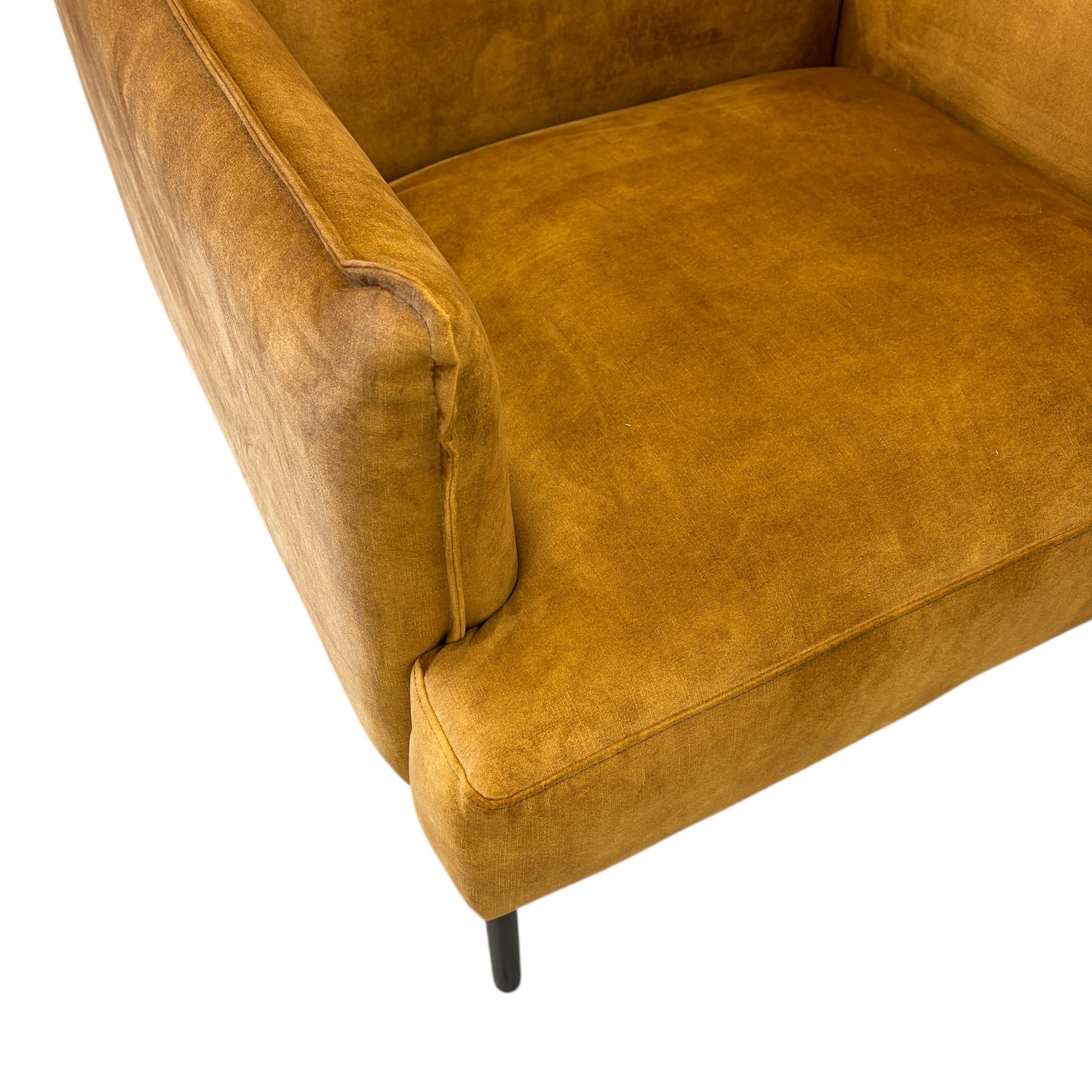 Sydney armchair in Gold fabric showing arm detail and cushion seat