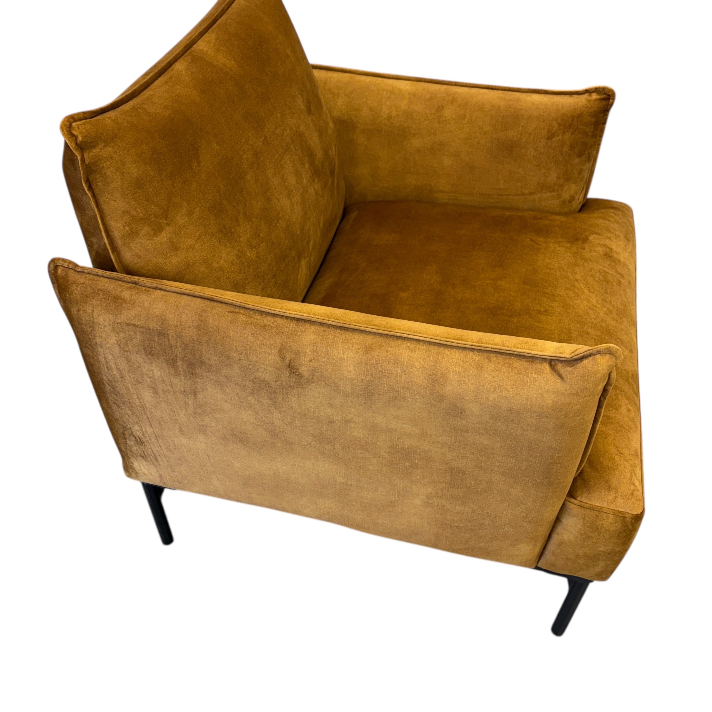 Side profile of the Sydney armchair in Gold with supportive cushioning and contemporary styling.