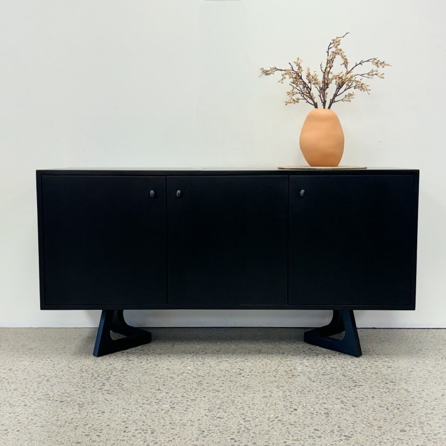 Tex Sideboard in black mango wood styled with a vase and decorative branches