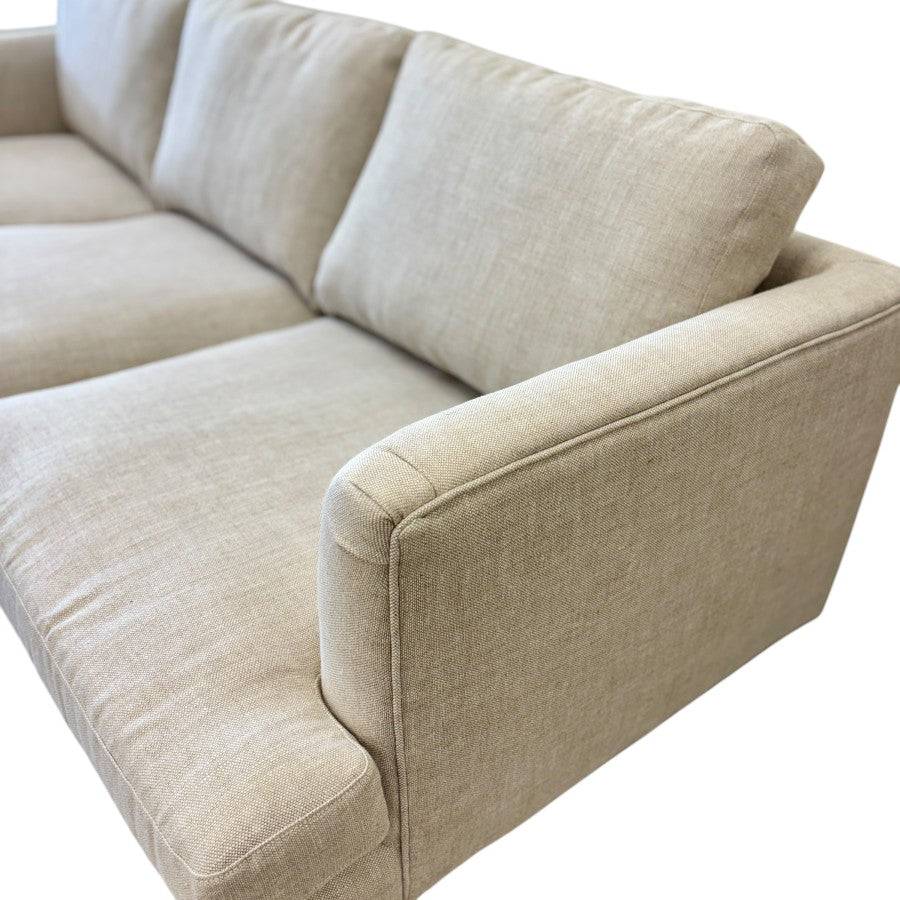 Close-up of the Thomas Sofa's generously padded seat and back cushions, highlighting the relaxed tailoring and linen upholstery.