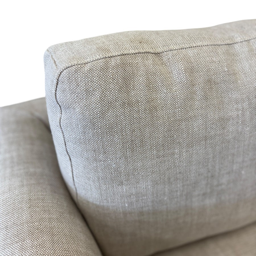 Close-up of the Thomas Sofa's Oat linen upholstery, showcasing the natural woven texture and premium fabric finish.