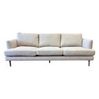 Thomas Sofa in Oat Linen featuring clean contemporary lines, deep seat cushions and solid timber legs.