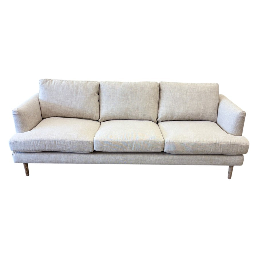 Overhead view of the Thomas Sofa in Oat Linen, showcasing its generous seating, supportive back cushions and contemporary design.