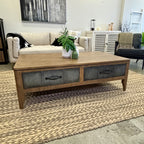 Tin Man Coffee Table in solid mango wood with brushed metal drawers and Smokehouse finish styled in a contemporary living room.