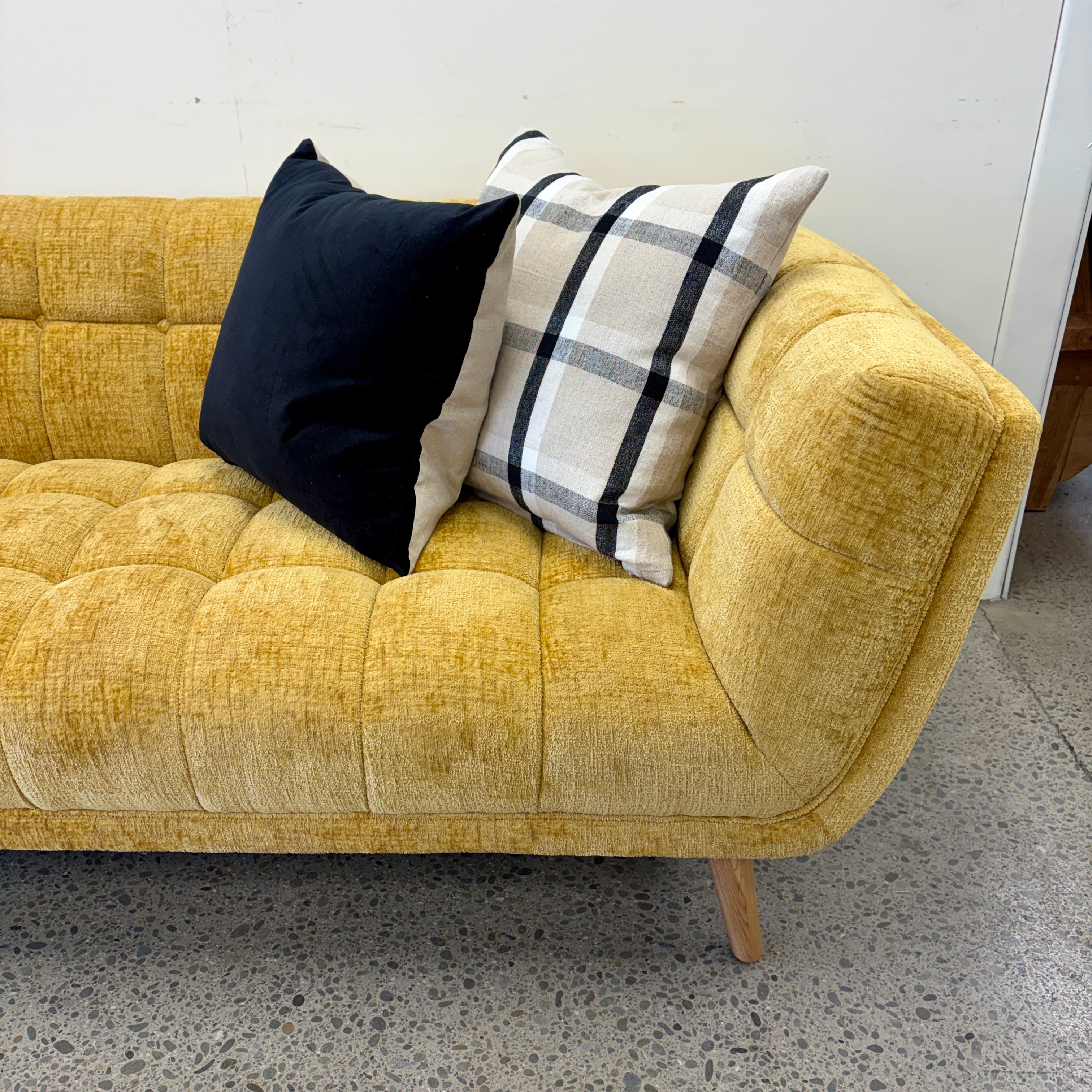 Close-up of the Towelie sofa's Yellow seat and back cushions, highlighting the soft woven fabric and comfortable cushioning.