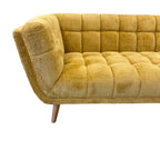 Side profile of the Towelie sofa in Yellow with supportive cushions and contemporary styling.