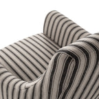 Close-up of Tyler Tub Chair showing black and linen striped upholstery and curved arms