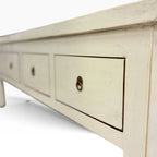 Angled view of Valtteri Low Console with four drawers and metal ring handles
