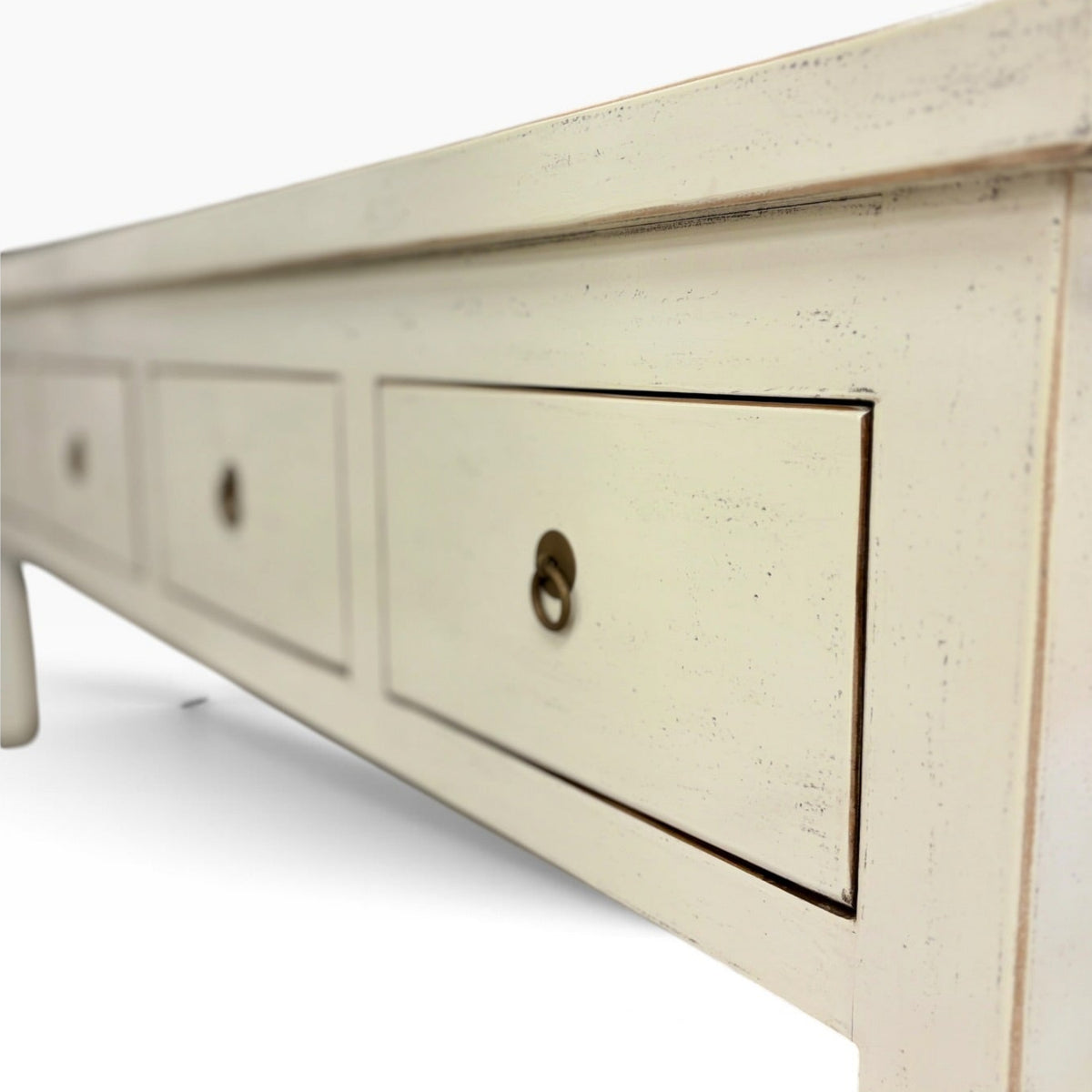 Angled view of Valtteri Low Console with four drawers and metal ring handles