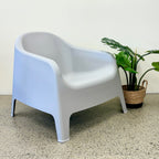 Wainui Outdoor Chair in Grey styled with potted greenery