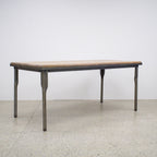 The Workman Dining Table paired with a matching timber bench, creating a relaxed and practical dining setting.